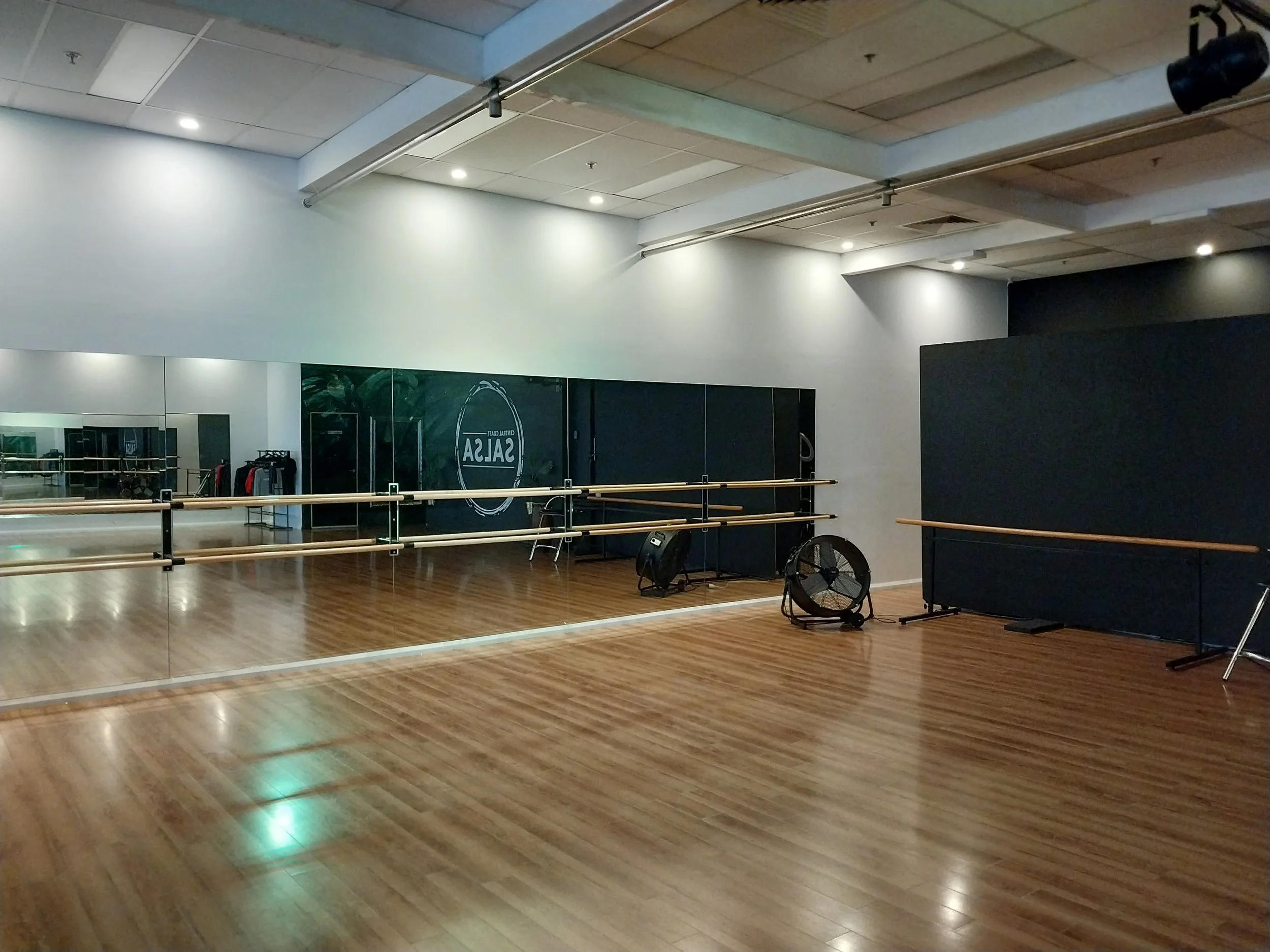 A calm dance studio space prepared for stretching and mindful movement